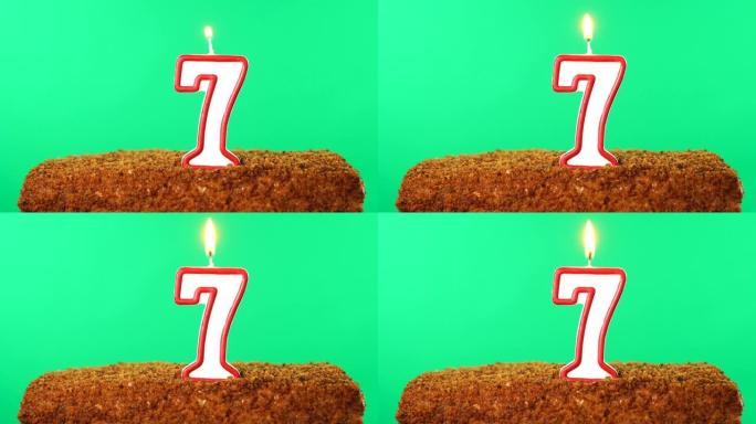 7号点燃蜡烛的蛋糕。色度键。绿屏。隔离