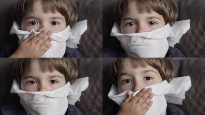 不健康生病的男孩的肖像用餐巾纸关闭她的鼻子过敏或鼻炎。不幸的孩子患有流鼻涕，打喷嚏和鼻涕。儿童感冒流