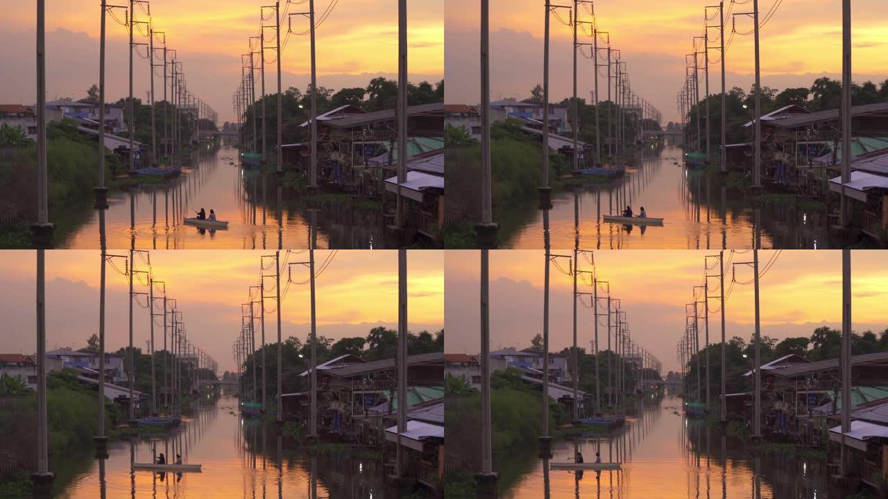 电线杆塔和电缆线和湄南河，在泰国曼谷日落时反射湖泊，能源电气技术和工业概念。