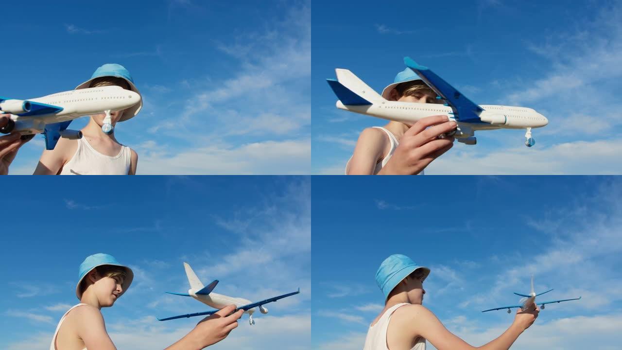 戴着帽子的男孩在天空背景上玩飞机，男孩想成为一名飞行员
