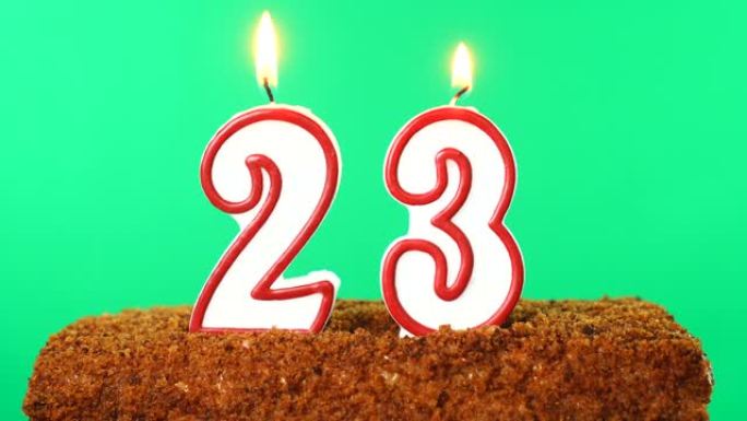 用23号点燃蜡烛的蛋糕。色度键。绿屏。隔离