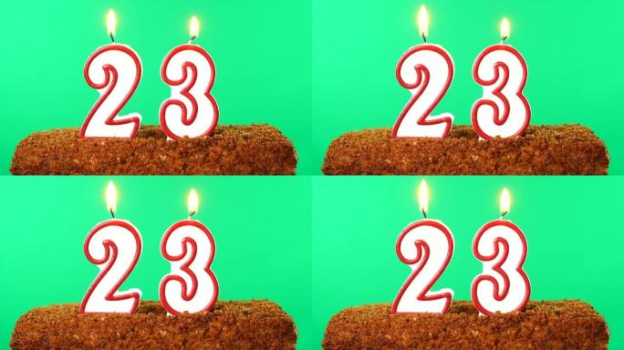 用23号点燃蜡烛的蛋糕。色度键。绿屏。隔离