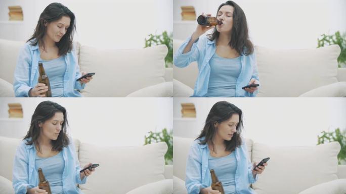 Slowmo. Tipsy的黑发女人正在通过智能手机聊天，拿着一瓶啤酒并喝着它。