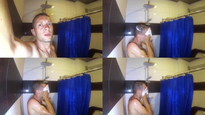 年轻的白人男子洗澡，高兴他的心情。洗他的头。