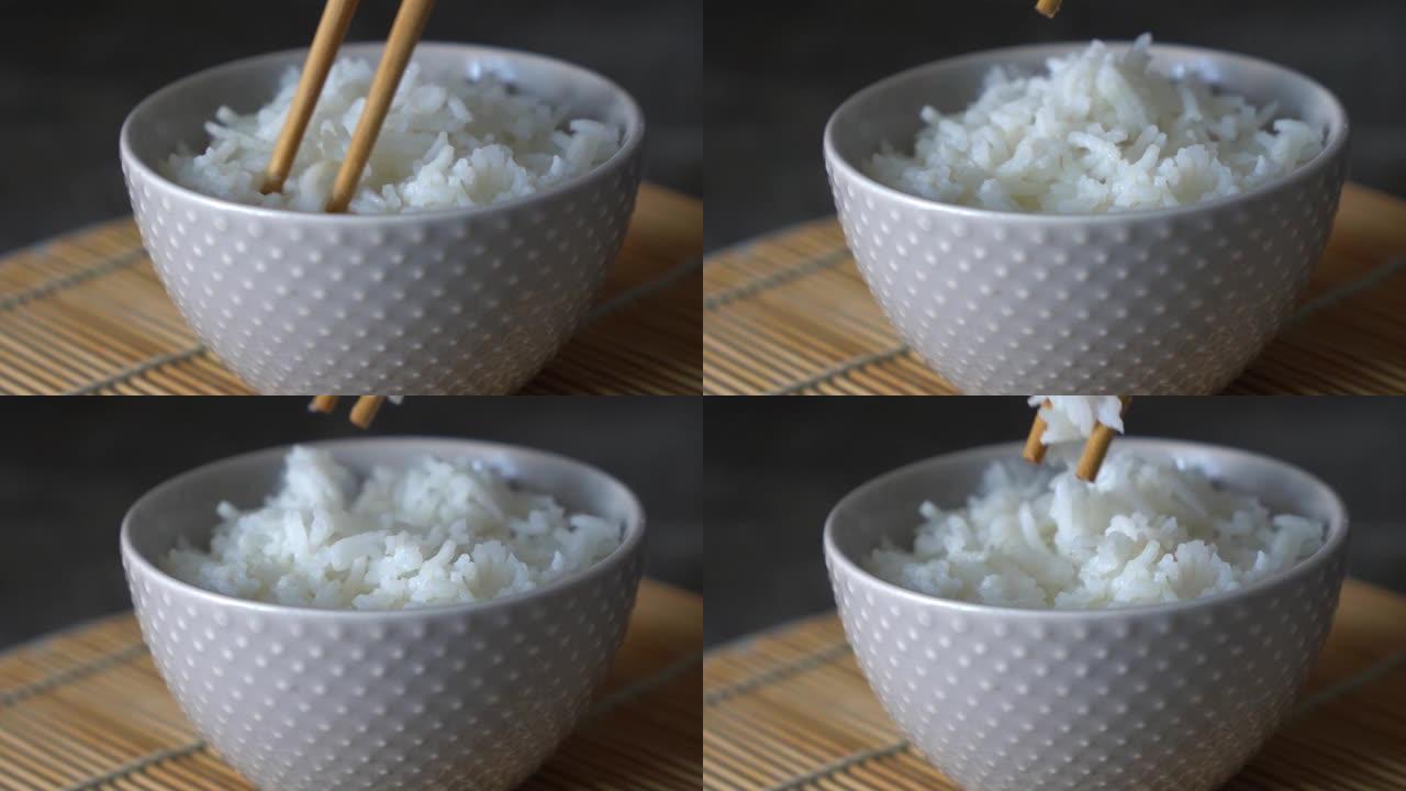 一个男人用碗筷吃饭的特写视频高清慢动作