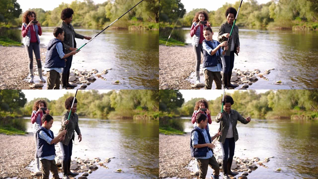 单身母亲和两个孩子一起享受河钓