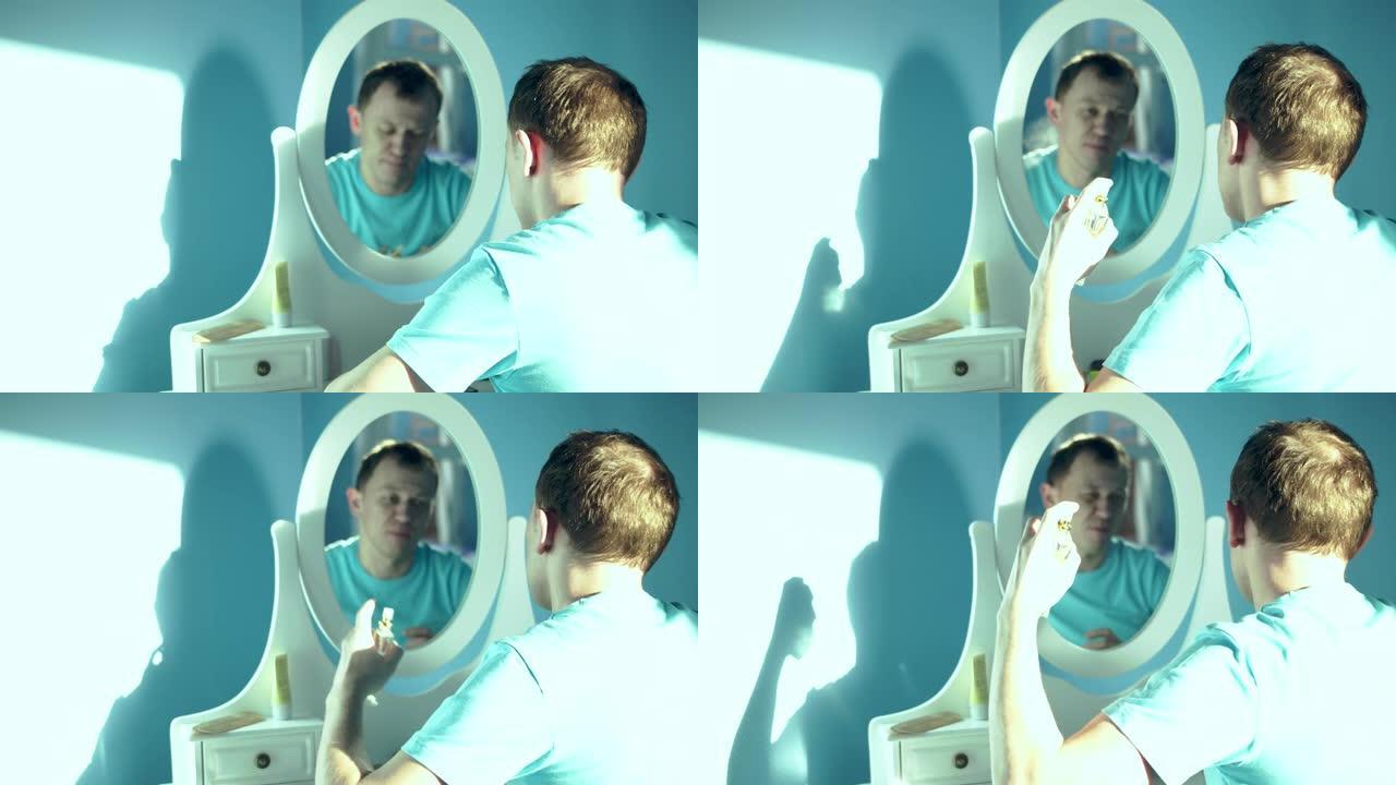 年轻人坐在镜子前，在自己身上喷香水