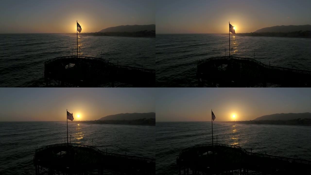 美国国旗在文图拉码头日落时关闭