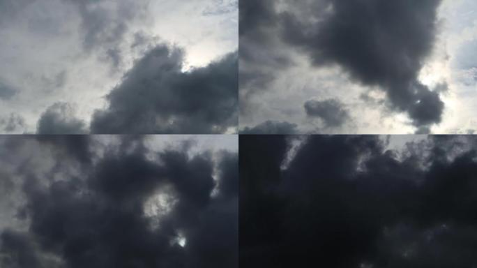 飓风前带有太阳光线和阳光的戏剧性深灰色云