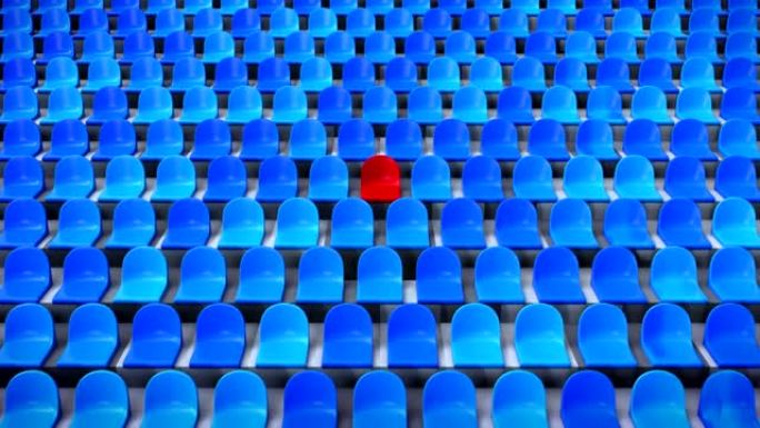 从体育场内独特的红色椅子上缩小