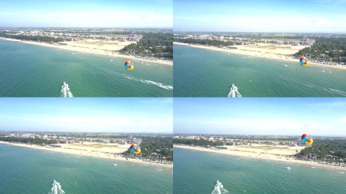 带降落伞的上层人士飞越海洋对抗城镇