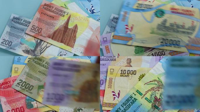 马达加斯加钱，Ariary，算在桌子上，各种钞票