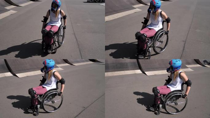 坐在轮椅上的残疾妇女在滑板公园做特技