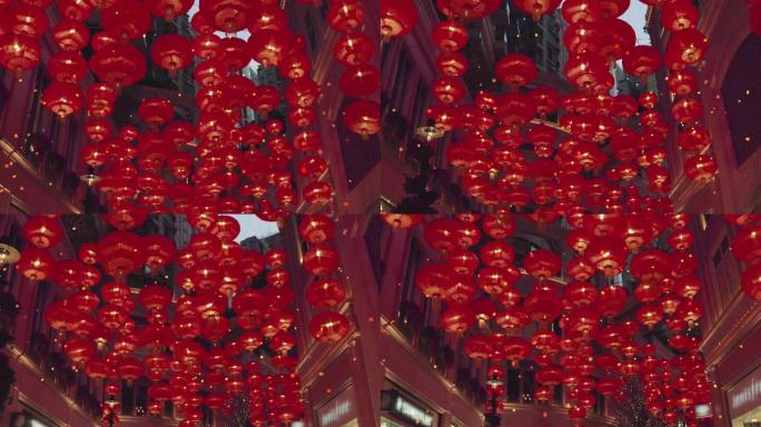 红色燃烧的中国灯笼沿着城市街道升起