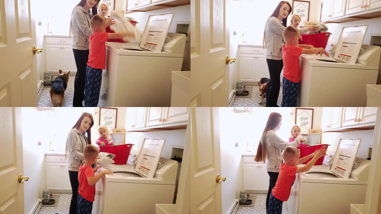 年轻的母亲和孩子们在家庭家庭视频系列中一起洗衣服