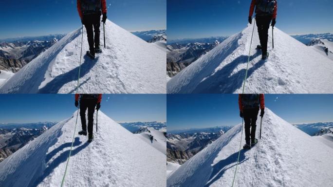 勃朗峰 (蒙特比安科) 登顶前的最后一步4,808米的人穿着登山服，靴子用冰爪在绳子队行走。手持后团