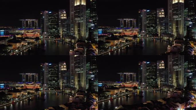夜间照明新加坡市中心滨海湾河畔航空全景4k