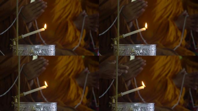 用烛光祈祷和尚