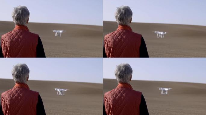 专业女性无人机飞行员操作相机无人机