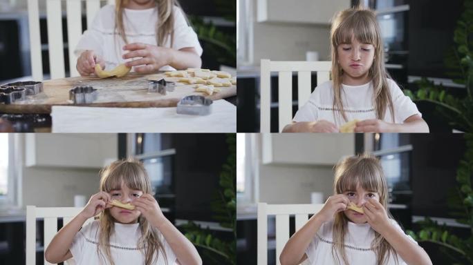 穿着白色连衣裙的长发的小女孩在准备烘烤饼干时，用生面团留了胡子。以星星和心的形式用生面团制作饼干的孩