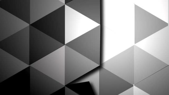 三角形的表面在不同的灰色提示中一个接一个地转动。