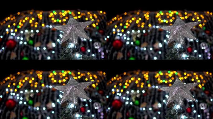 晚上圣诞树上的明星装饰特写。主题在右边。