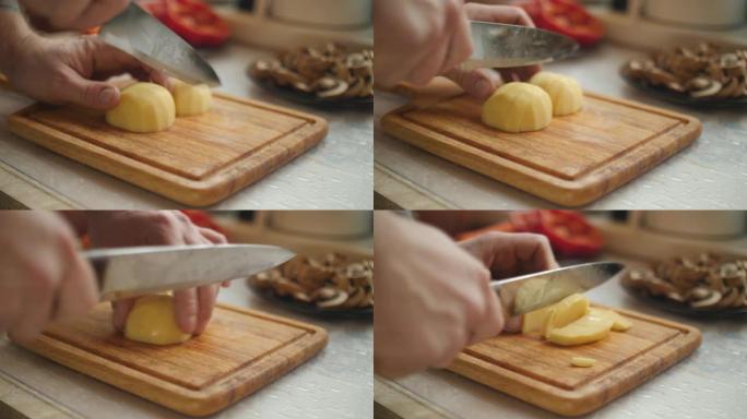 在切菜板上切土豆切土豆做饭做菜