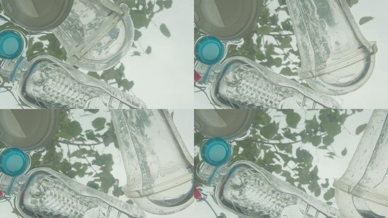 塑料瓶和垃圾漂浮在河水中的特写镜头