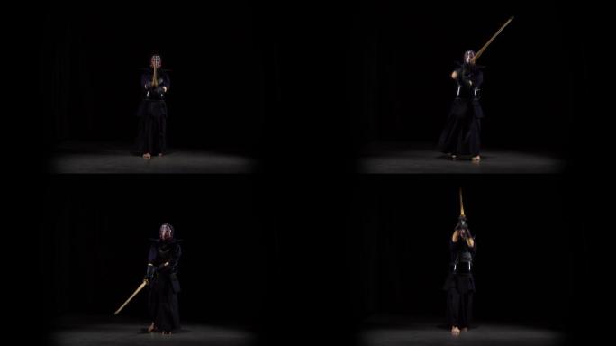 强壮的剑道大师在黑色背景上练习武术