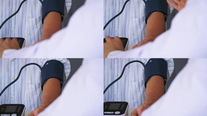 医生测量老人的血压。