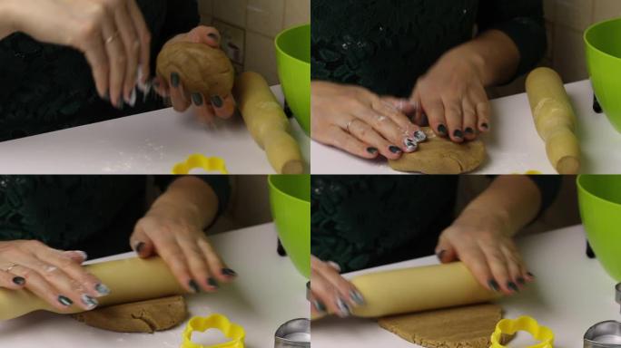 女人正在准备姜饼饼干。她用手揉捏面团，然后用a面杖将其滚动。