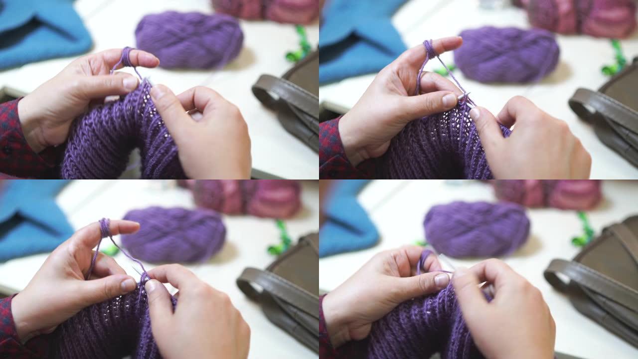 手工制作的传统针织。女人用缝衣针缝针。