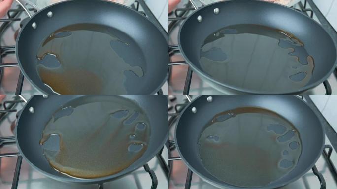 摊开/摇动平底锅，以便在4k内用油覆盖整个底部表面。摆动pon到底部的概念。