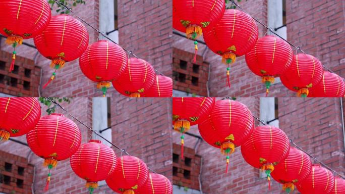 美丽的圆形红灯笼挂在古老的传统街道上，中国农历新年的概念，特写。