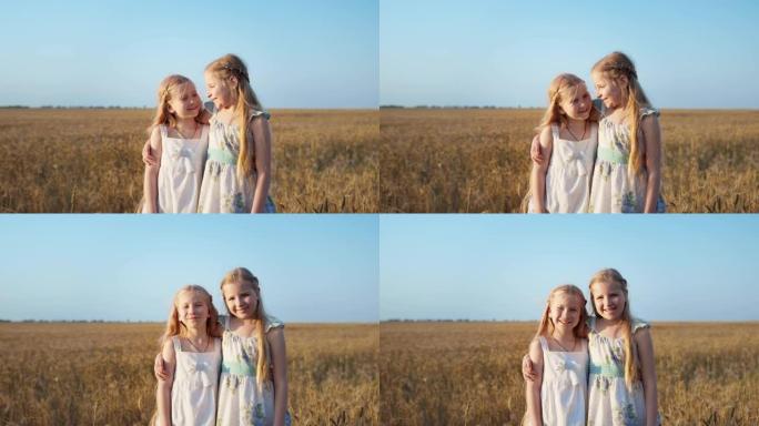 乡下的女朋友，两个长发的女孩子互相拥抱，看着蓝天背景下麦田上的相机