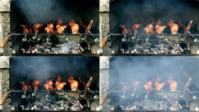 烧烤火盆的特写视图在金属串上烹饪大火鸡或鸡肉腿，在燃烧的煤上燃烧着火焰和烟雾。传统的东欧烧烤派对在家