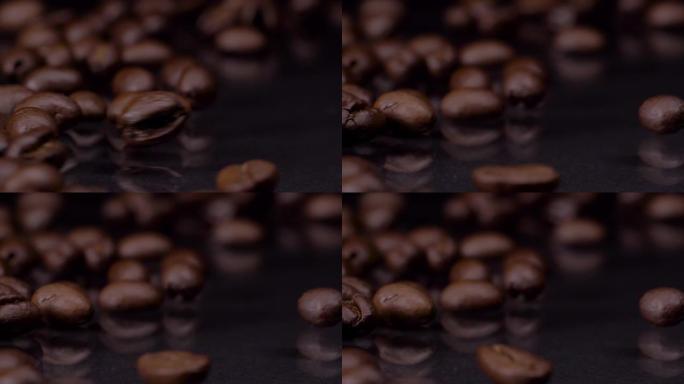 惊人的质量。超级慢动作拍摄的优质新鲜烤棕色咖啡豆滚动，落在木桌上，深色背景。咖啡谷物关闭4k视频