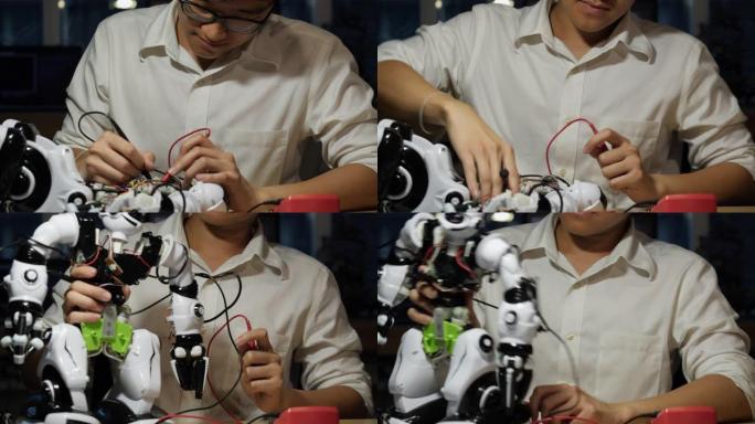 亚洲男子工程师在实验室组装和测试机器人手臂反应。建筑师设计电路同步技术和协作开发机器人。