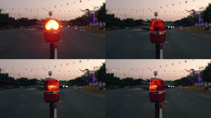 警告旋转警报器一天闪烁信号。带红色报警灯的铁丝网