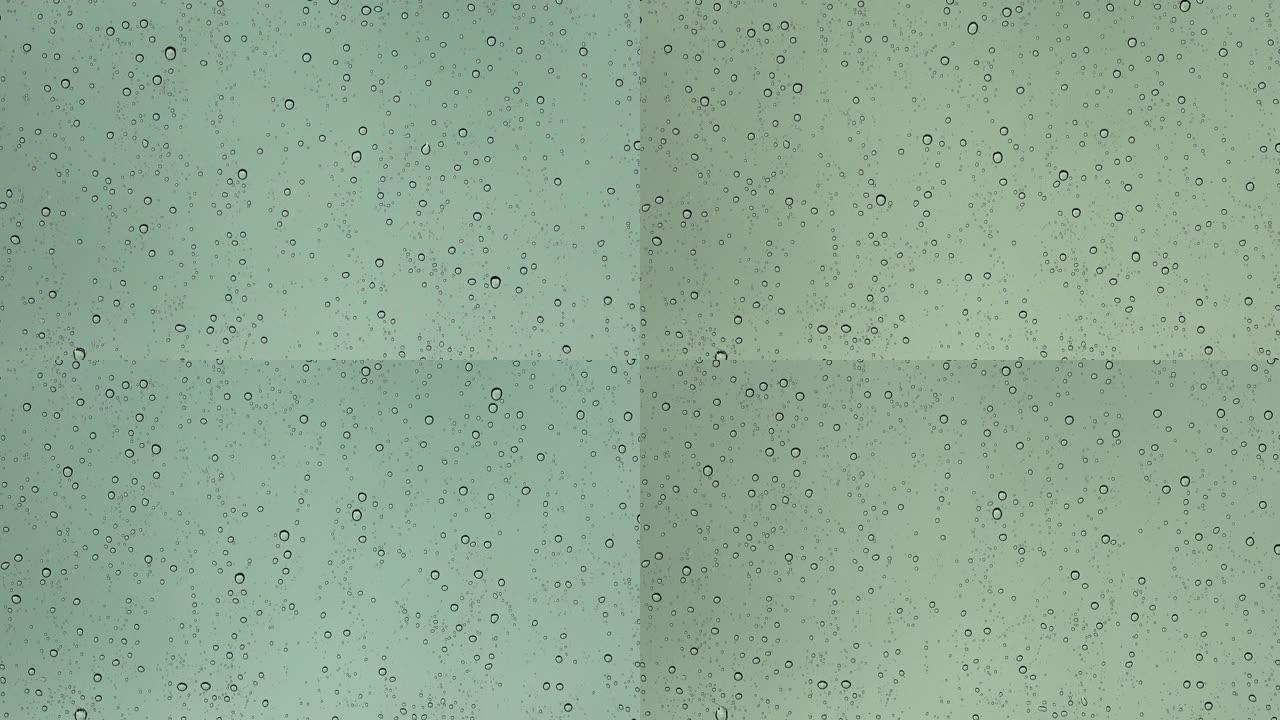 近距离观看时，雨滴从车窗上掉下来