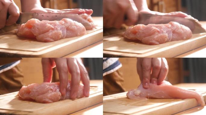 轻盈慢动作在砧板上切鸡肉。