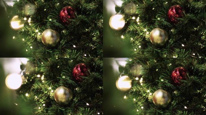 4k彩色球挂在圣诞树上，圣诞节和新年快乐展示，运动镜头，假日装饰活动，快乐的幸福，缓慢运动的多莉效果