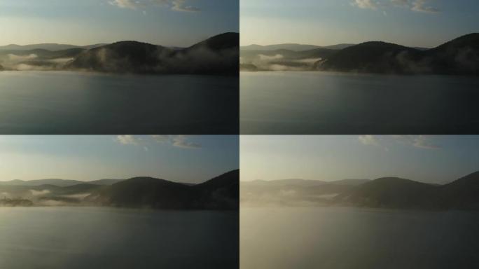 雾中的日出鸟瞰图山川峡谷绿色环保雾气腾腾