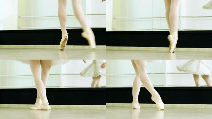 芭蕾舞演员的脚在舞蹈工作室的脚尖鞋中踮起脚尖跳舞。4K