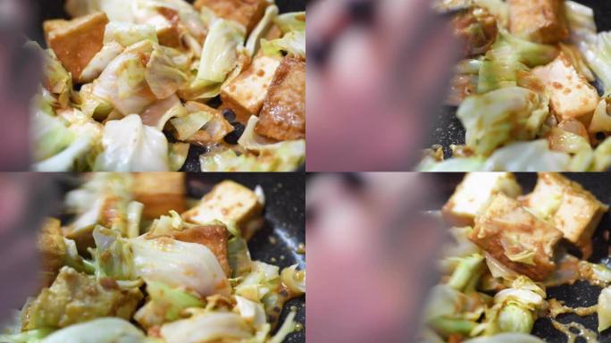 炒豆腐和白菜做菜视频素材