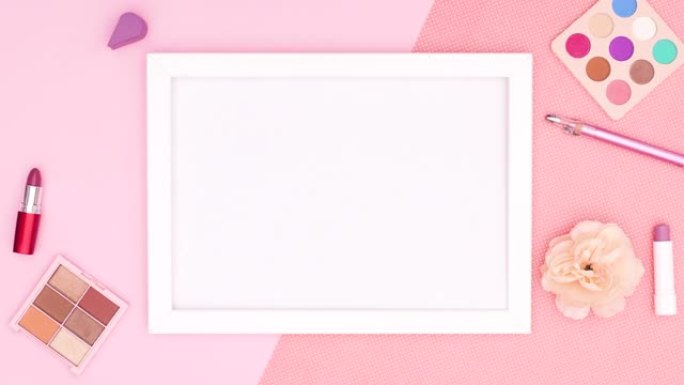 化妆和配件出现在粉红色主题的白色框架周围。停止运动