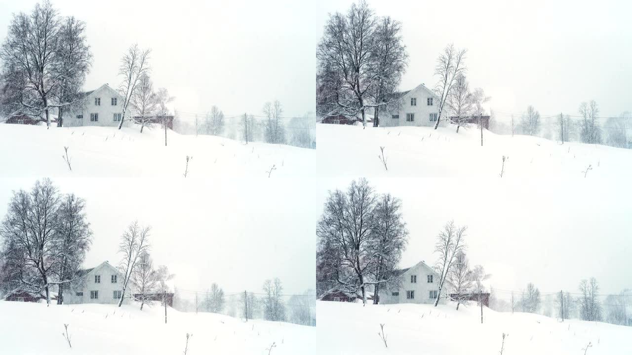 挪威乡村大雪期间带有经典木屋的冬季景观