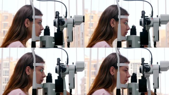 眼科治疗-一名年轻女子检查她的视力-瞳孔对光的反应