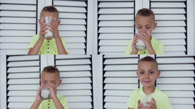 一个健康的小男孩和一杯牛奶的肖像。一个男孩正在白门里喝牛奶。健康饮食。正确的生活方式。小男孩喝牛奶