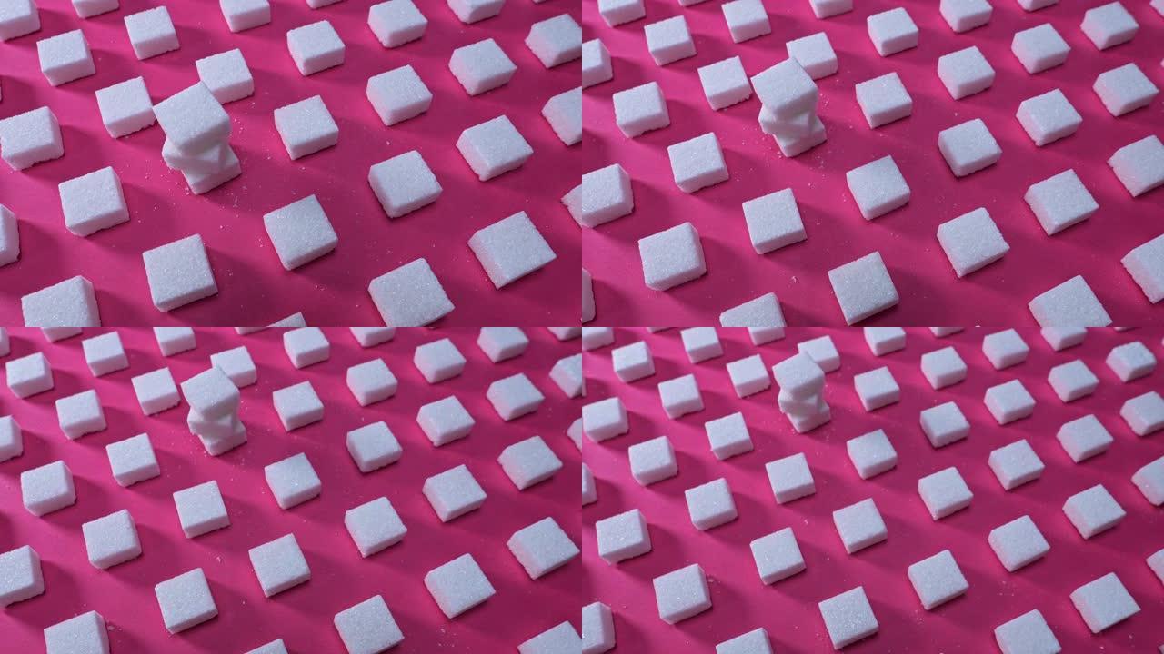 在粉红色背景上图案方糖，在镜头中平移